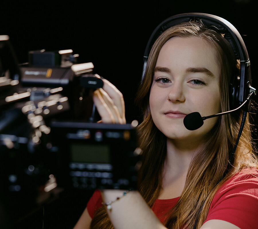 a cinema arts student holding a video camera