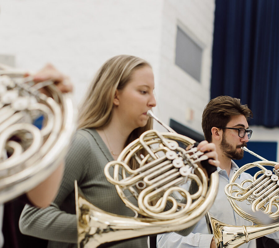 students from the music education program playing the french horn